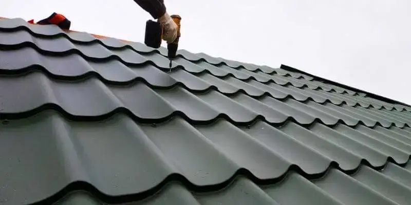 Roofers install new technology shingles